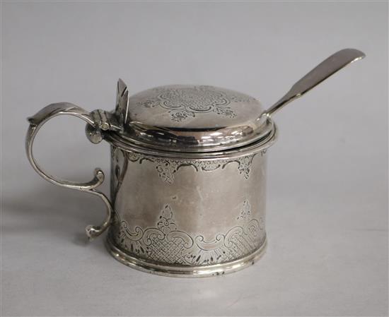 A Victorian silver drum mustard with engraved decoration, London, 1848 and a silver mustard ladle.